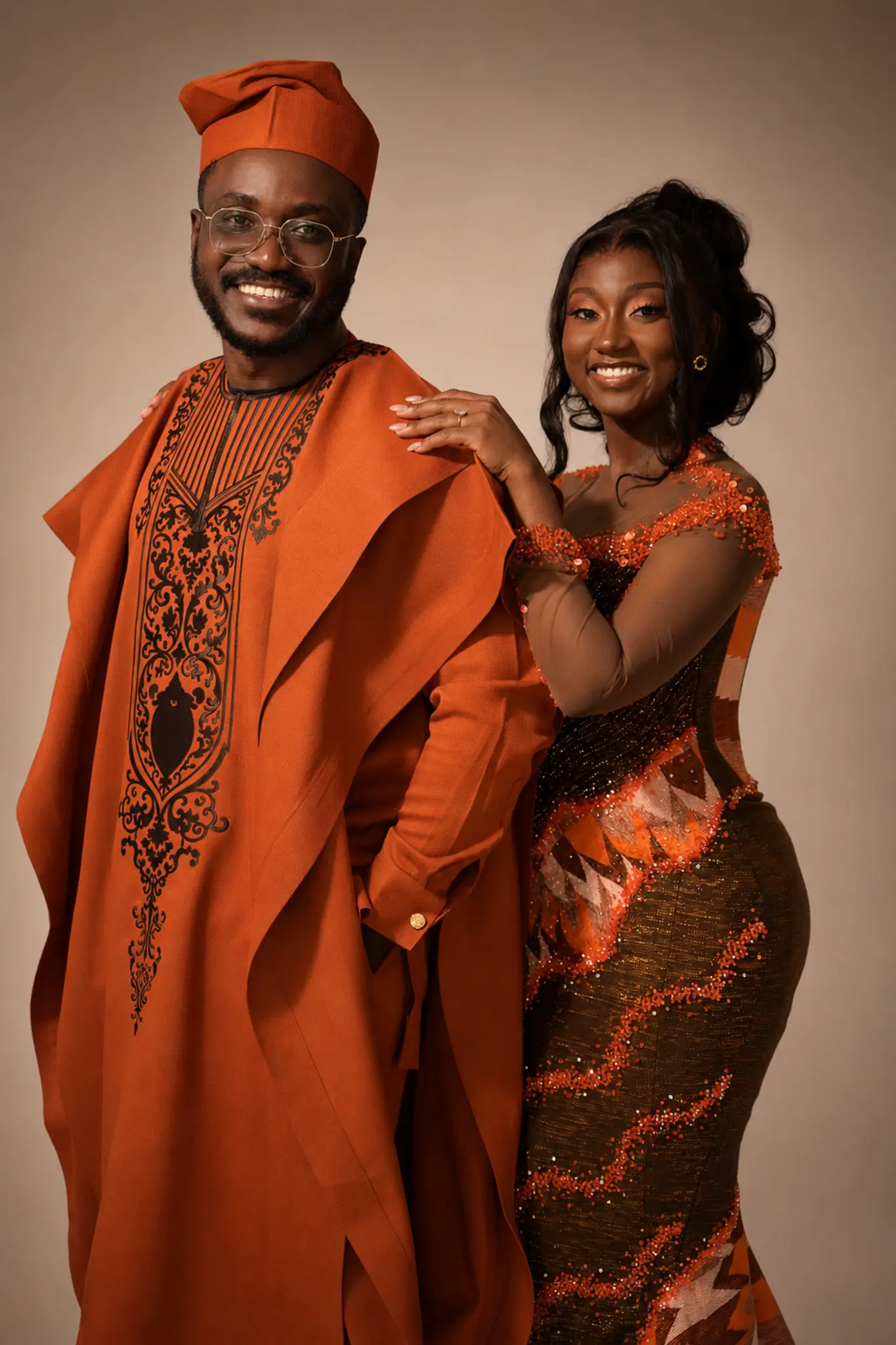 Kingsford and Perla smiling together in a classic studio portrait.